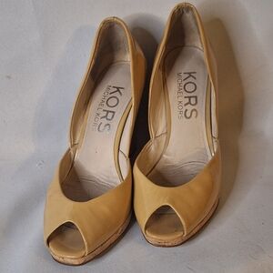 Previously used. Micheal Kors Womans Beige Wedges Heels Size 6